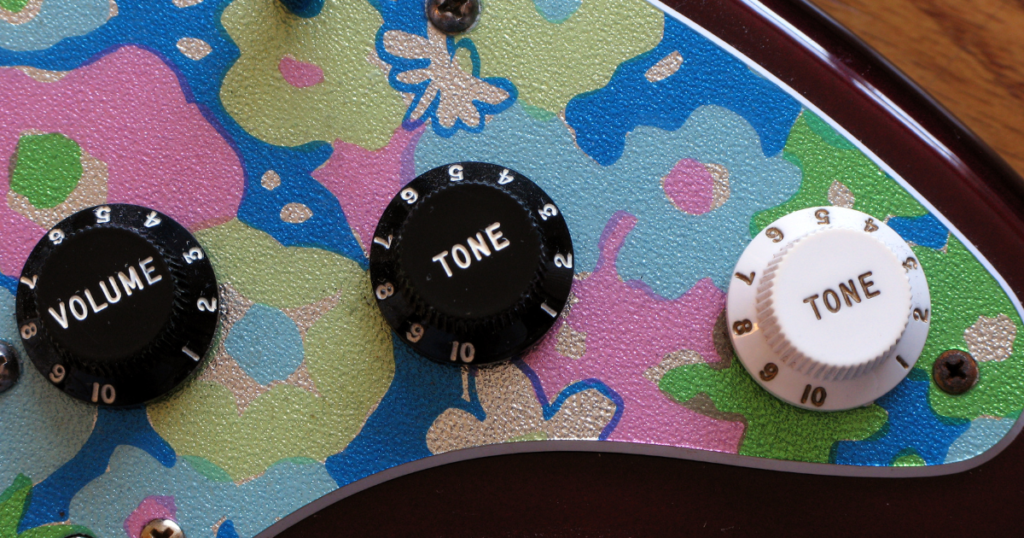 Image of guitar volume and tone knobs.